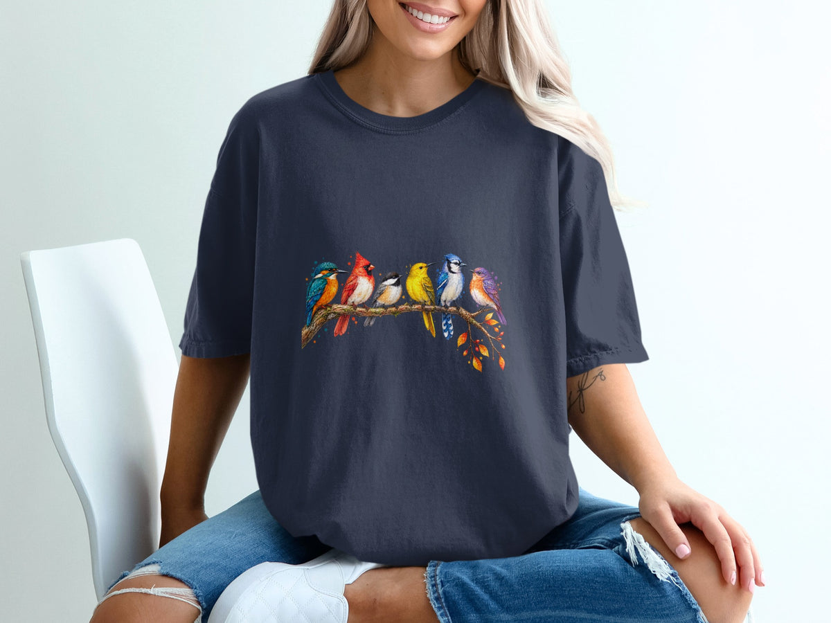 Dark blue t-shirt with a watercolor-style print of six colorful birds perched on a branch.