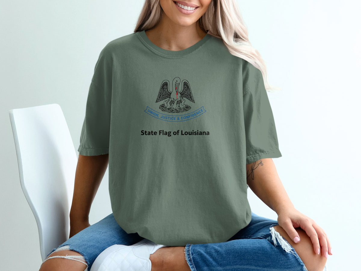 Green t-shirt with Louisiana flag design: pelican feeding chicks, "Union, Justice & Confidence"