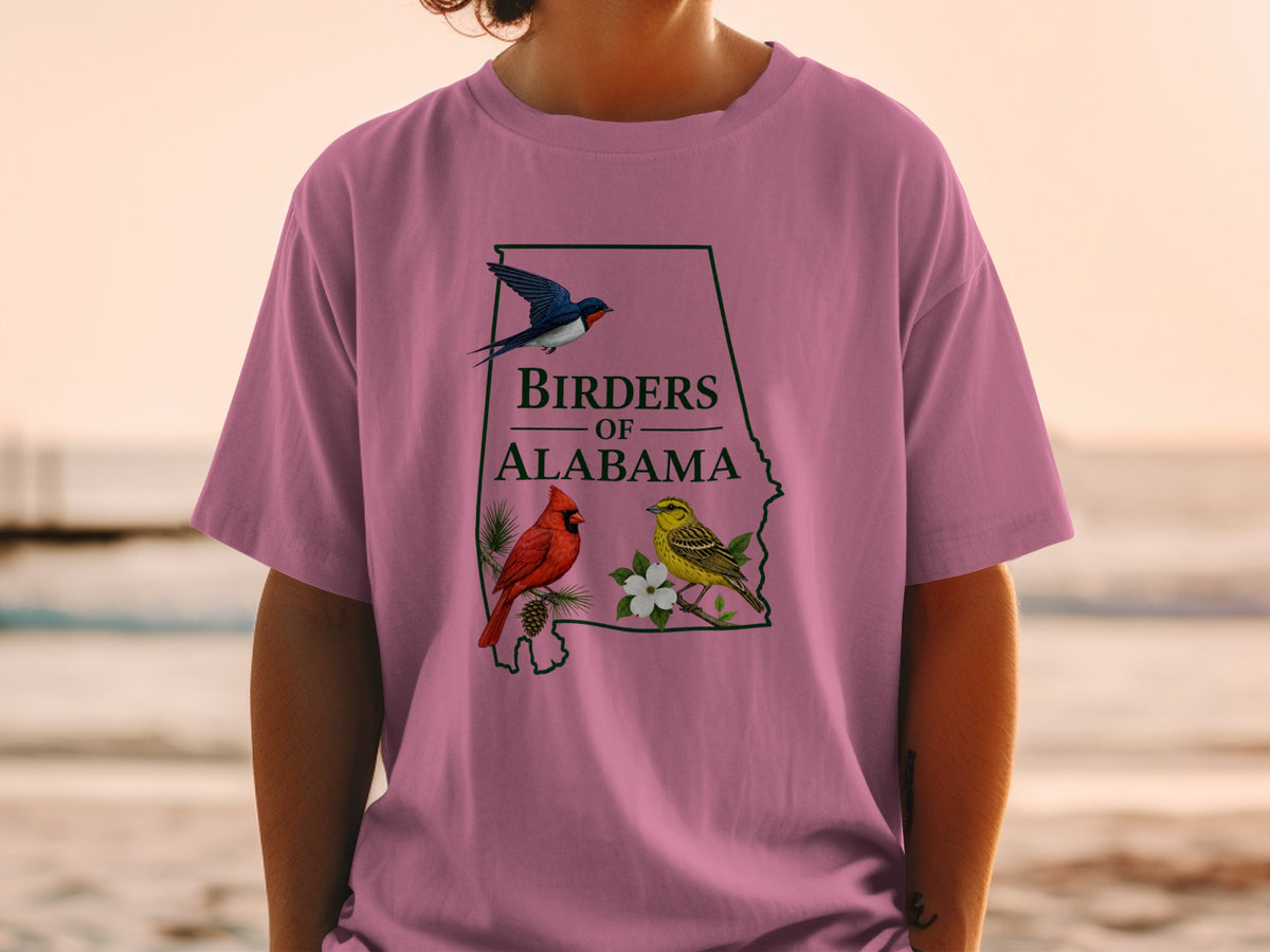 Pink t-shirt with Alabama outline, text "Birders of Alabama", and three birds.