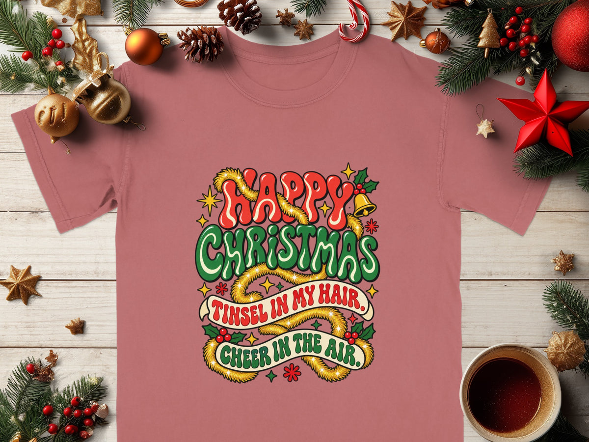 Pink t-shirt with "Happy Christmas" and "Tinsel in my hair, Cheer in the air."
