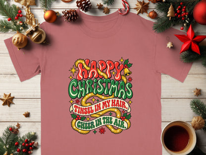 Pink t-shirt with "Happy Christmas" and "Tinsel in my hair, Cheer in the air."