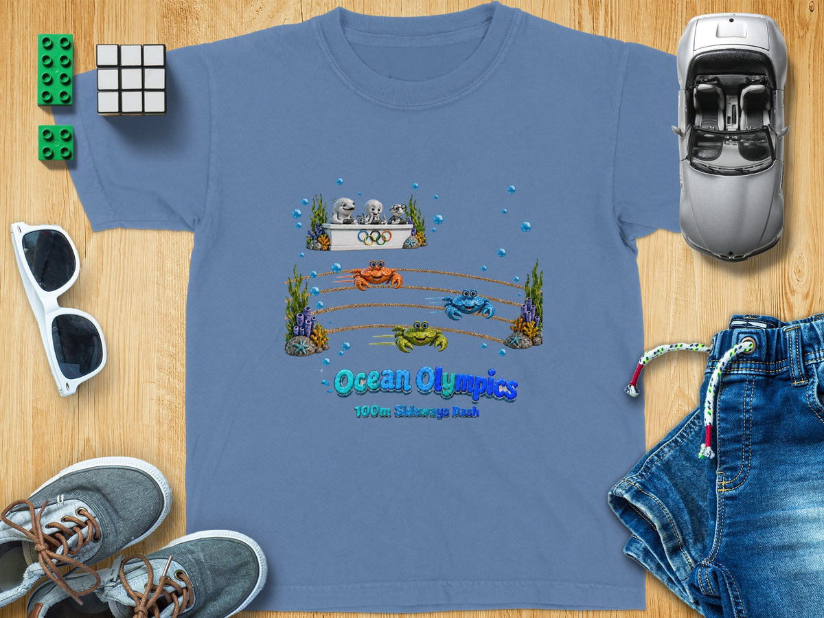 Blue t-shirt with Ocean Olympics crab race graphic and text.
