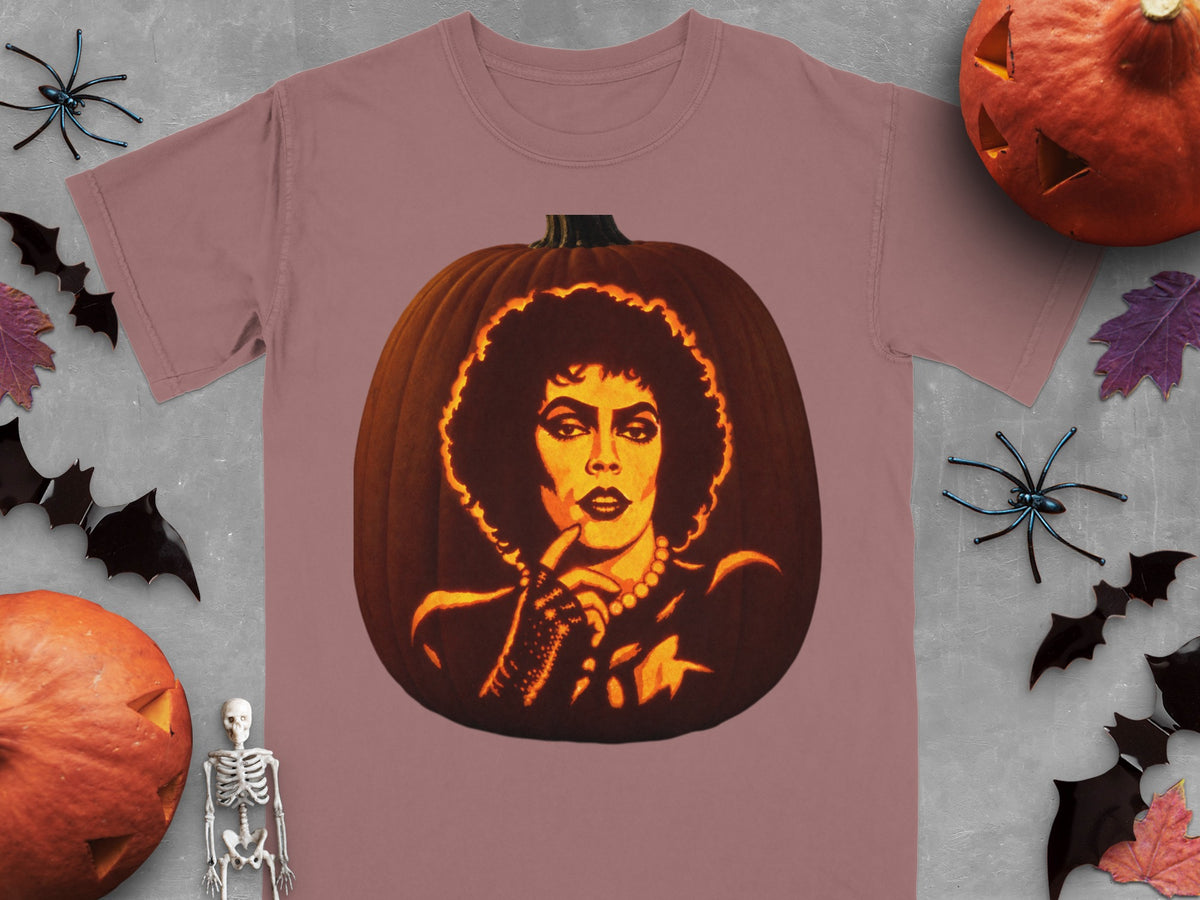 Dusty pink crewneck t-shirt featuring a lit jack-o-lantern carved with a portrait of Frank-N-Furter.