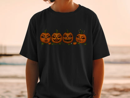 Four anthropomorphic pumpkins with makeup and expressive faces on a black t-shirt.