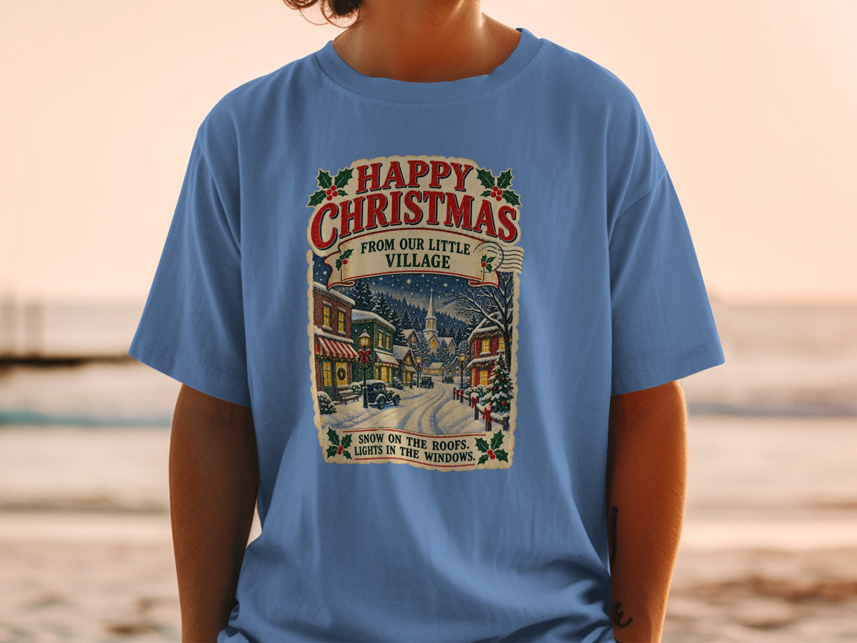 T-shirt with vintage Christmas village scene and text.