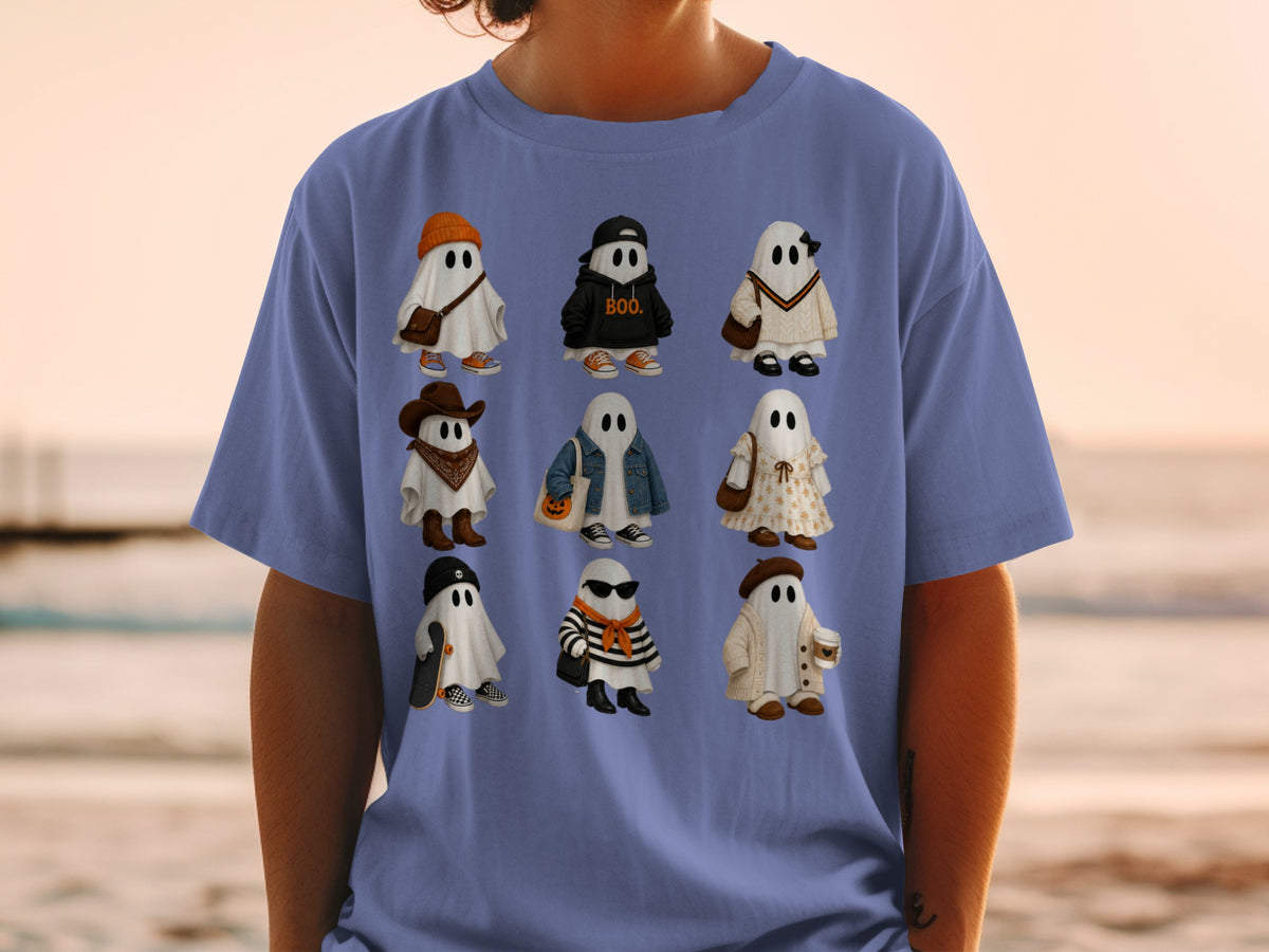 Nine illustrated ghosts in various outfits are printed on a blue t-shirt.
