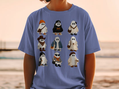 Nine illustrated ghosts in various outfits are printed on a blue t-shirt.