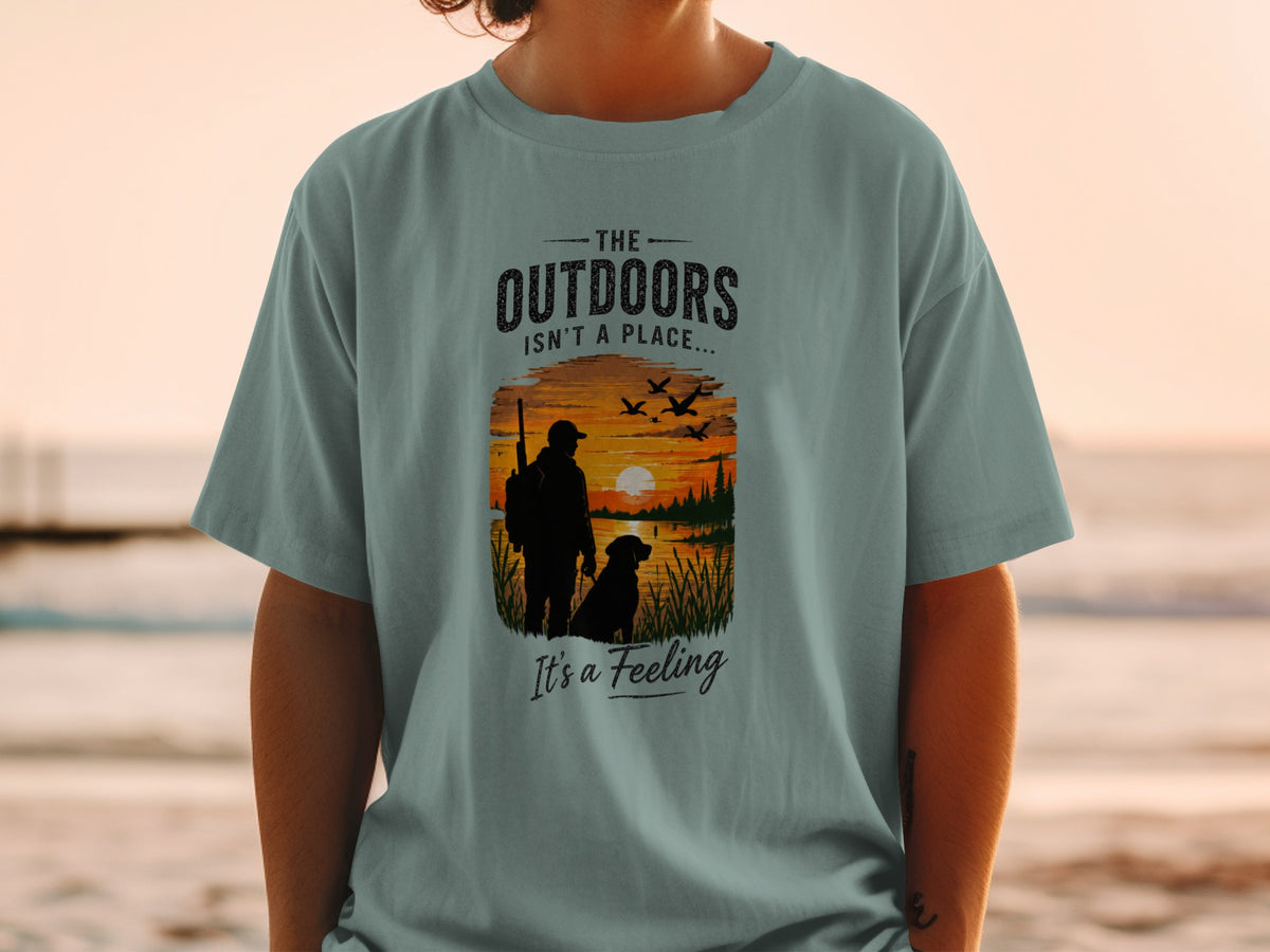 T-shirt with graphic: "The Outdoors Isn't a Place... It's a Feeling" and a sunset scene.