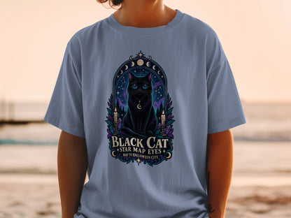 Black cat with starry eyes and crescent moon pendant, text "Black Cat Star Map Eyes Map to Halloween City."