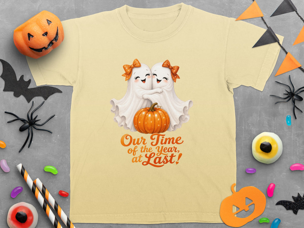 Two cute ghosts hug in front of a pumpkin with "Our Time of the Year, at Last!"