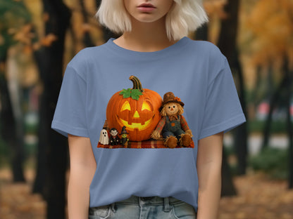 Halloween graphic with jack-o-lantern, scarecrow, ghosts, and witch on a plaid blanket.