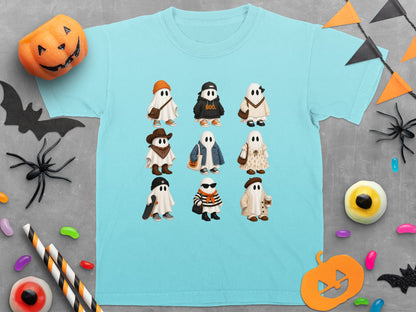 Nine cute ghosts in various outfits and hats are printed on a light blue t-shirt.