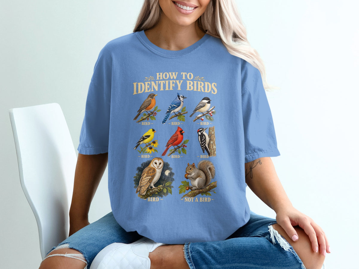 T-shirt graphic with "How to Identify Birds" text and illustrations of various birds and a squirrel.