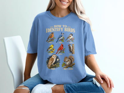 T-shirt graphic with "How to Identify Birds" text and illustrations of various birds and a squirrel.