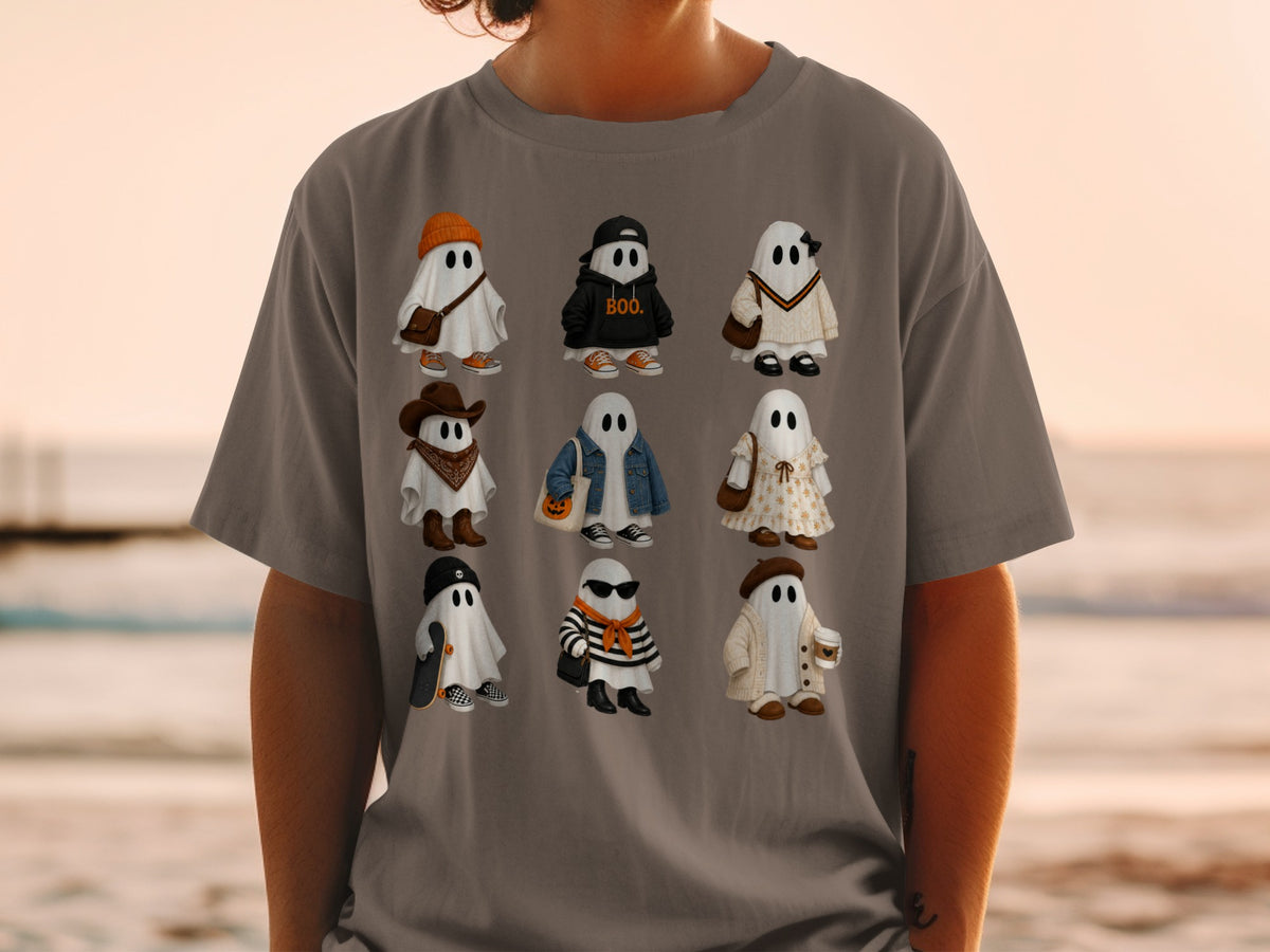 Nine cartoon ghosts in various outfits are displayed on a grey t-shirt.