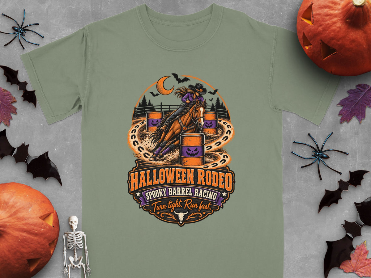 "Halloween Rodeo Spooky Barrel Racing" graphic with a rider and horse, orange barrels, moon, and bats.