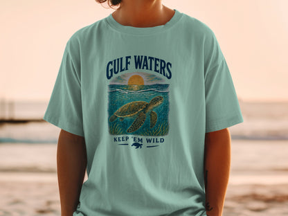 T-shirt graphic: Sea turtle with "GULF WATERS" and "KEEP 'EM WILD" text.