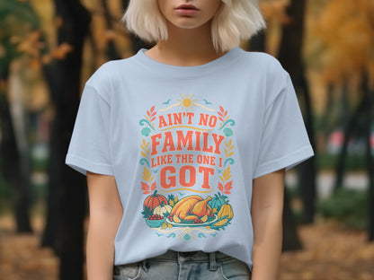 Light blue t-shirt with "Ain't No Family Like The One I Got" text and Thanksgiving graphics.
