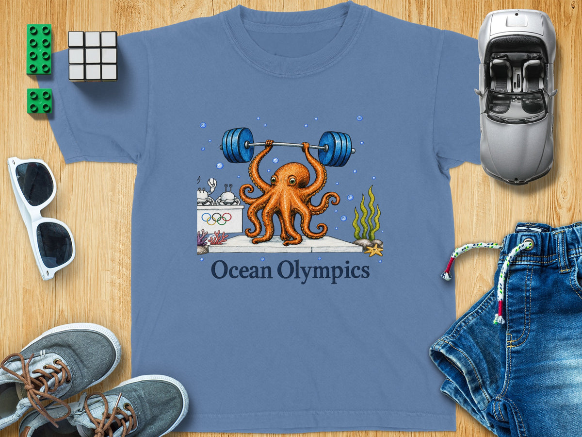 Blue t-shirt with illustration of an octopus weightlifting, text reads "Ocean Olympics".