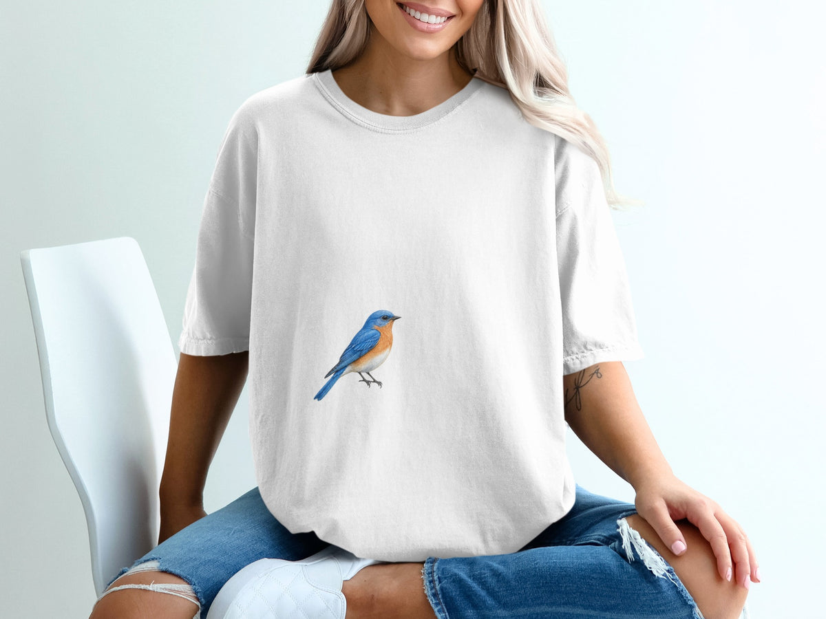 White t-shirt with a bluebird graphic on the chest.