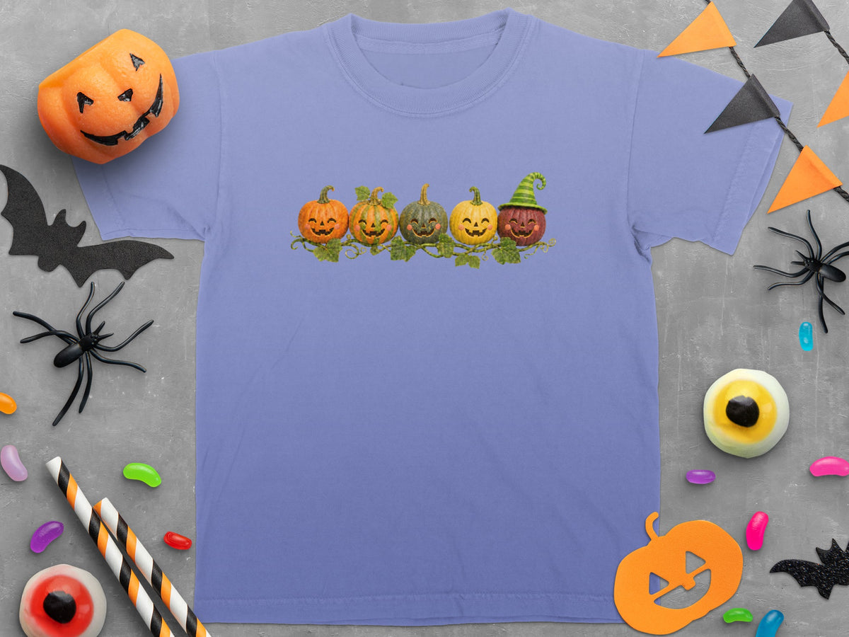 Periwinkle t-shirt with five smiling pumpkins in a row graphic.