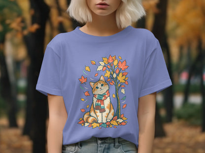Orange and white cat wearing a scarf sits under a tree with falling autumn leaves.