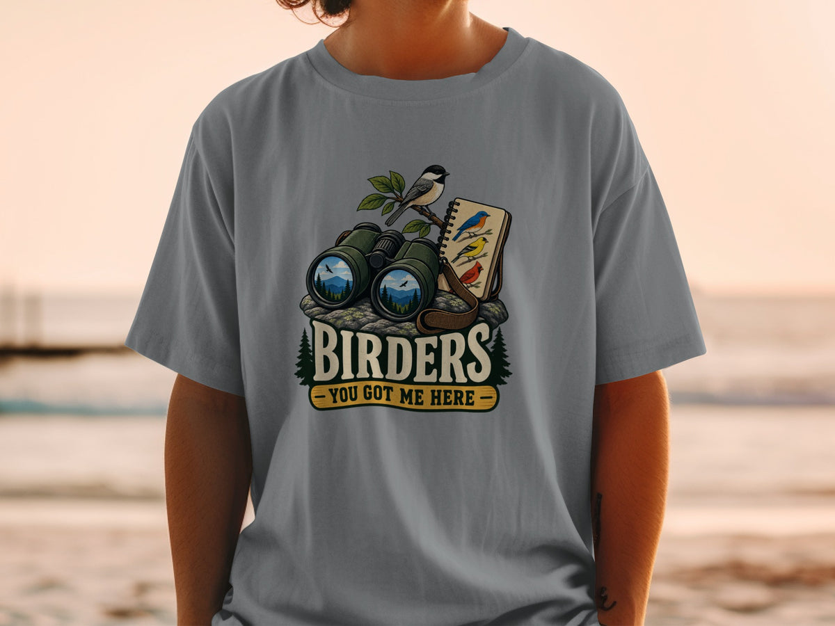 Binoculars, a bird on a branch, and bird sketches with text "BIRDERS - YOU GOT ME HERE".