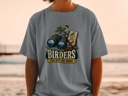 Binoculars, a bird on a branch, and bird sketches with text "BIRDERS - YOU GOT ME HERE".