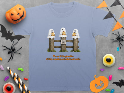 Light blue t-shirt with three ghosts sitting on a fence, eating toast.