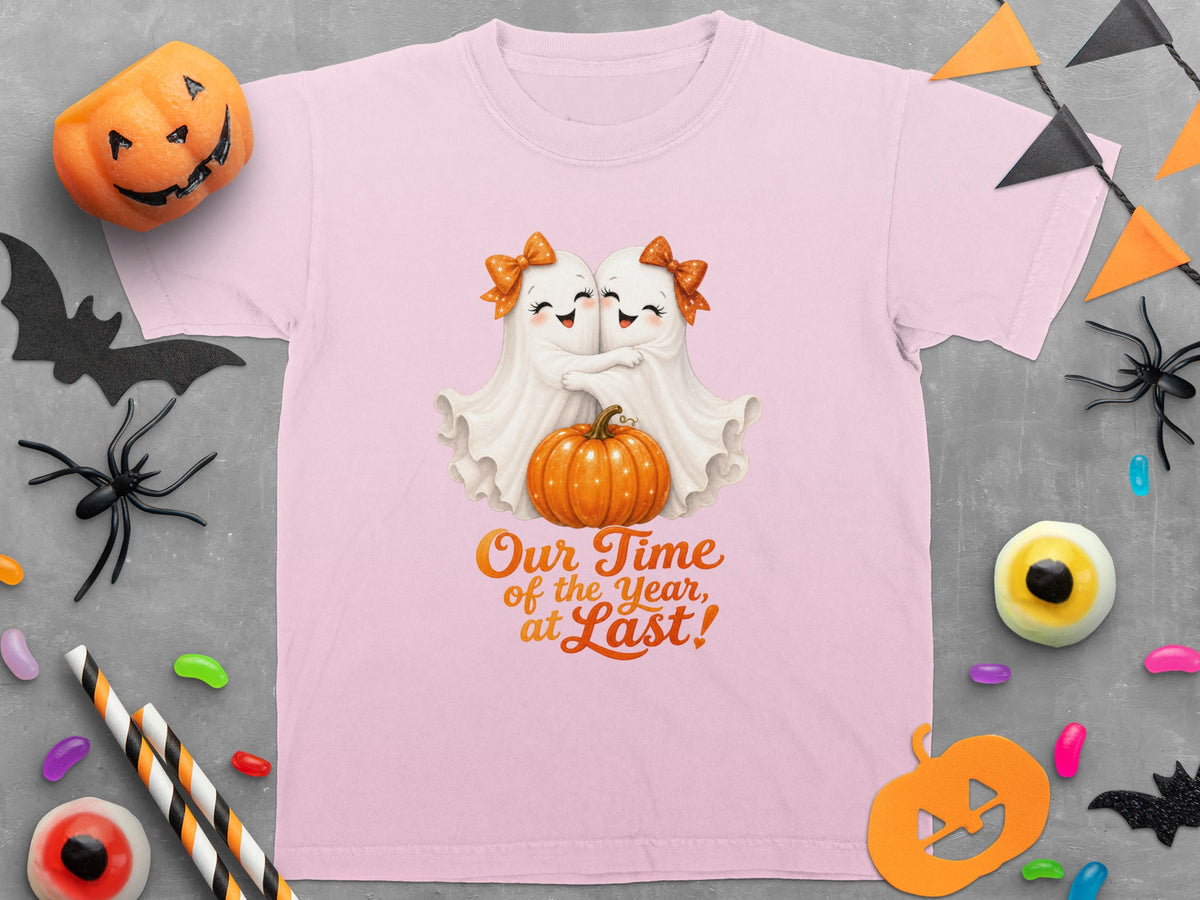 Pink t-shirt with two ghosts hugging a pumpkin and text "Our Time of the Year, at Last!"