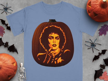 A blue t-shirt printed with a carved jack-o'-lantern depicting Frank-N-Furter, surrounded by Halloween decorations.