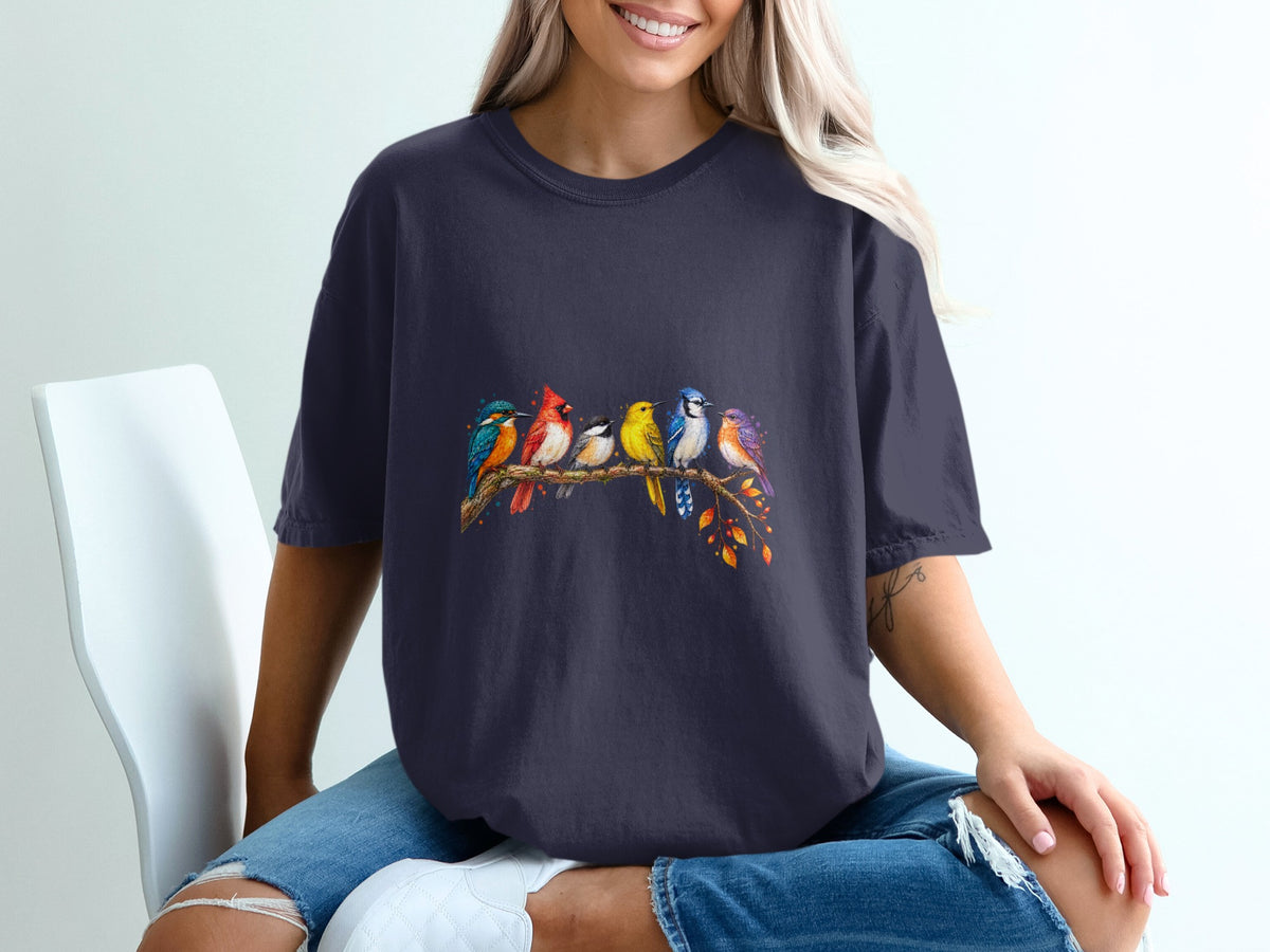 Dark t-shirt with a colorful flock of birds perched on a branch.