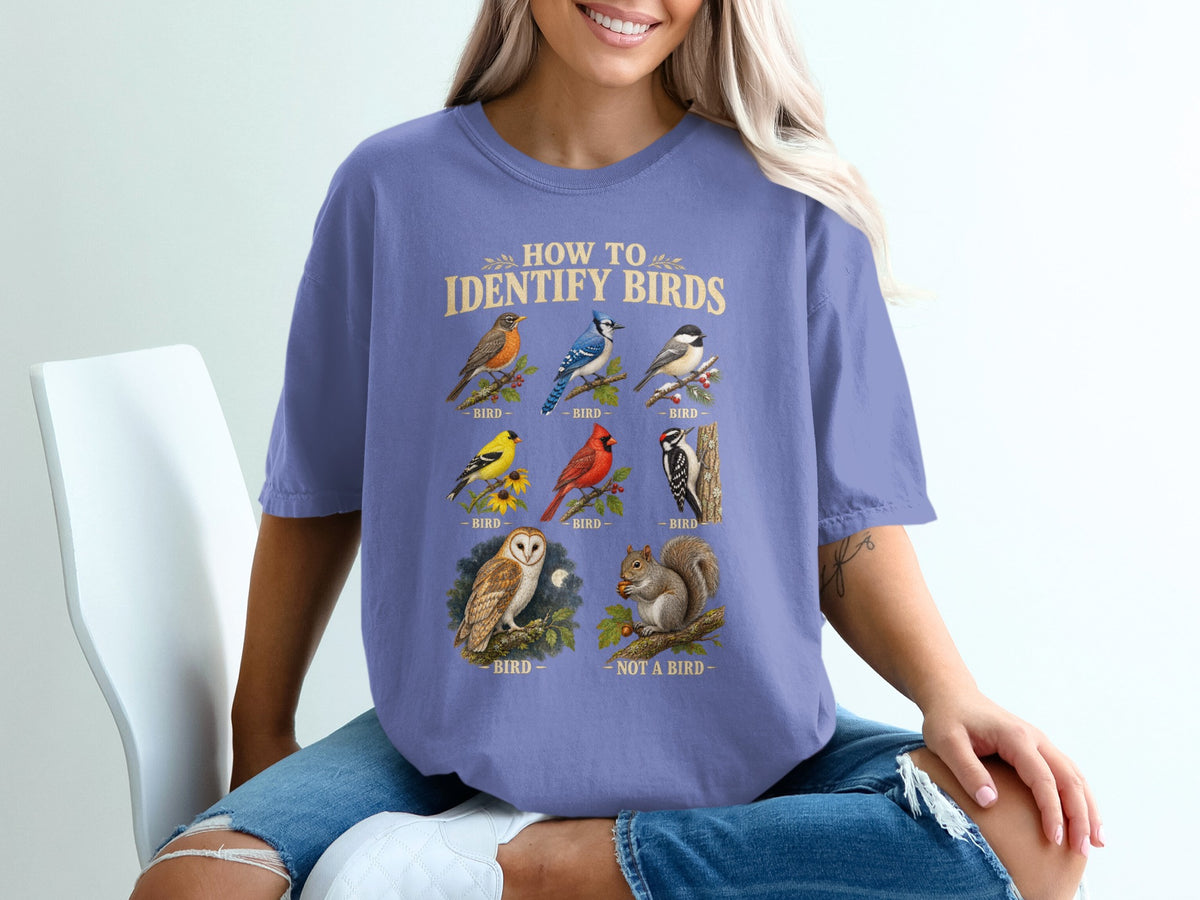 T-shirt with "How to Identify Birds" graphic showing various birds and a squirrel.