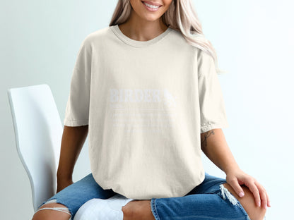 Cream t-shirt with white text defining "BIRDER" and an image of a bird.
