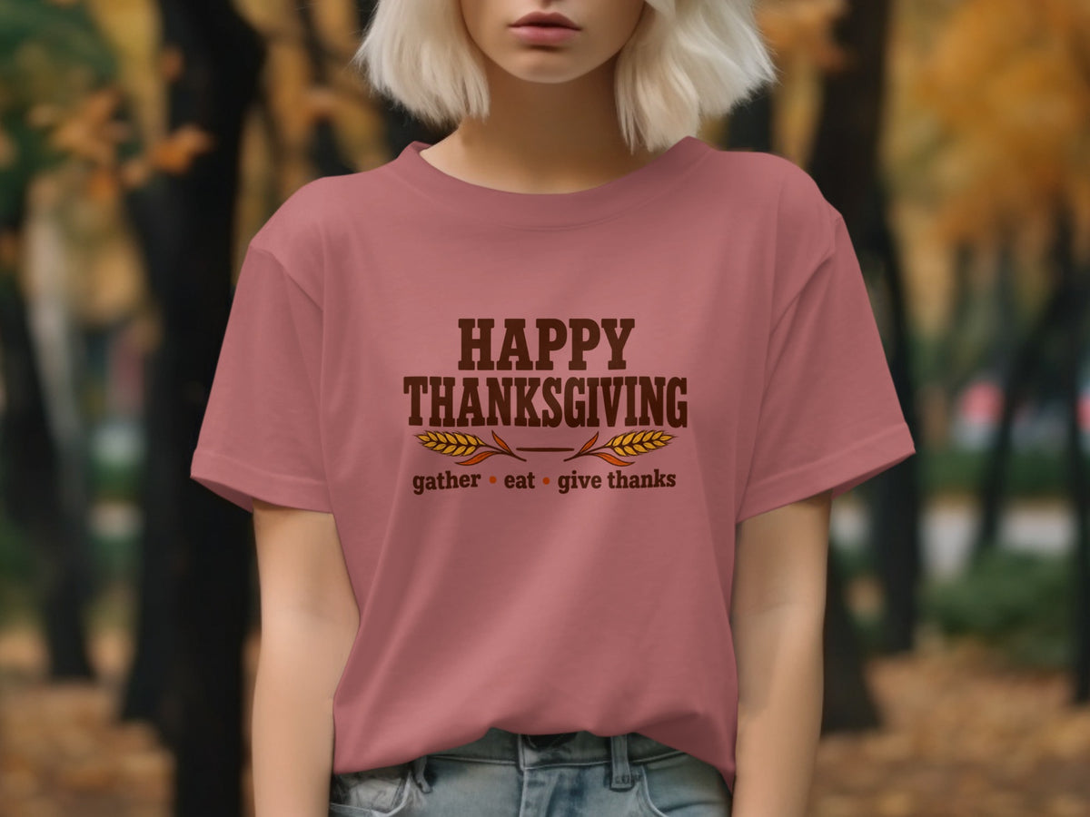 Pink t-shirt with "Happy Thanksgiving" and "gather eat give thanks" text.