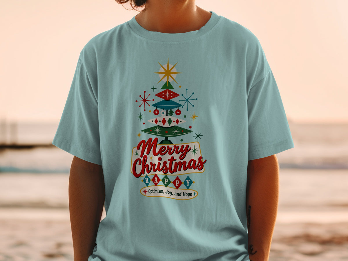 Light blue t-shirt with retro Christmas tree graphic and "Merry Christmas Happy" text.