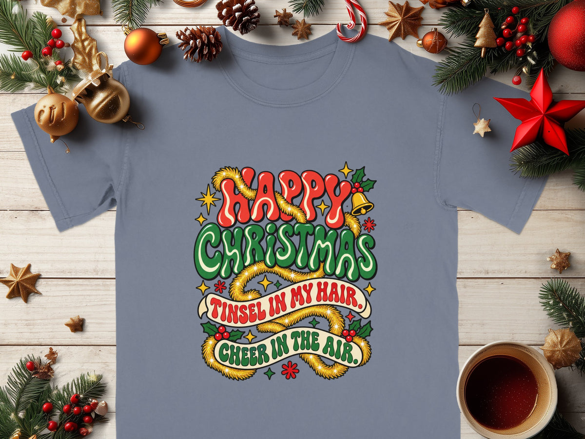 Gray t-shirt with "Happy Christmas Tinsel in my hair, Cheer in the air" holiday graphic.