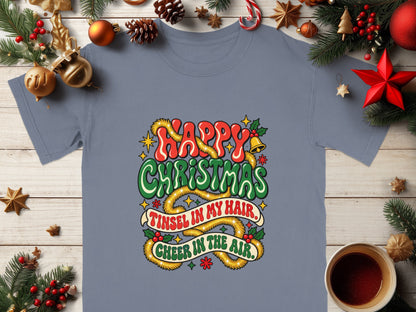Gray t-shirt with "Happy Christmas Tinsel in my hair, Cheer in the air" holiday graphic.