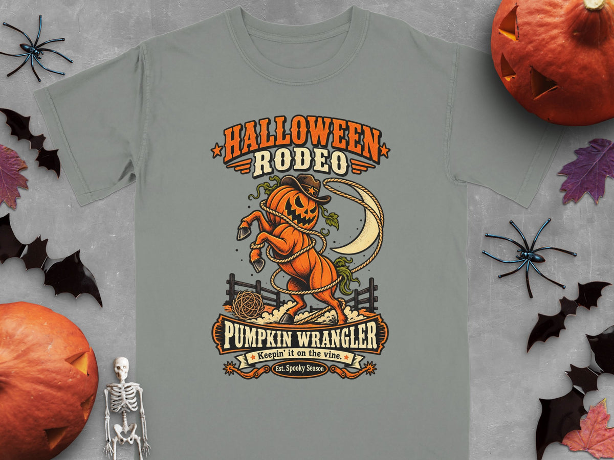Halloween Rodeo graphic with a pumpkin horse, lasso, and moon. Pumpkin Wrangler text.