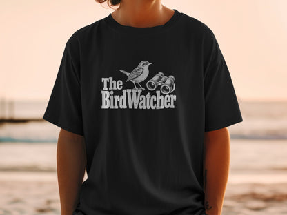 Black t-shirt with "The Bird Watcher" text, bird, and binoculars graphic.