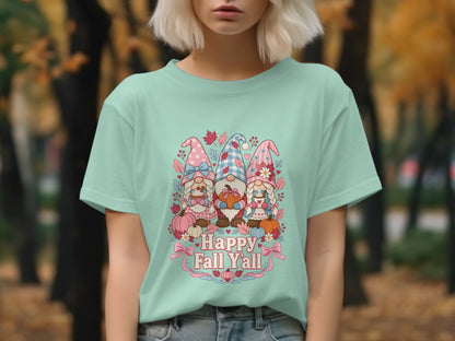 Three gnomes with pumpkins and fall leaves on a mint t-shirt with "Happy Fall Y'all" text.