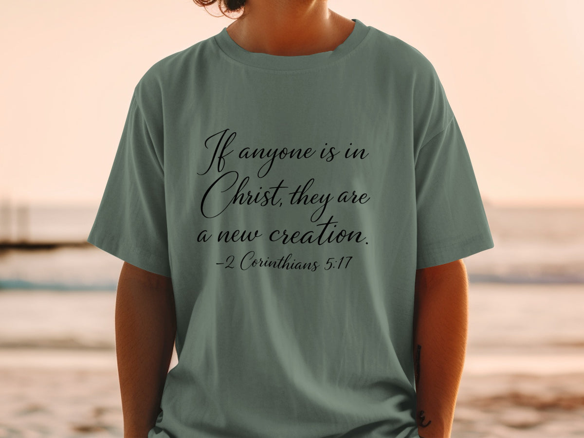T-shirt with text "If anyone is in Christ, they are a new creation. -2 Corinthians 5:17"
