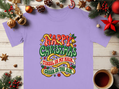 Purple t-shirt with "Happy Christmas, Tinsel in My Hair, Cheer in the Air" text design.