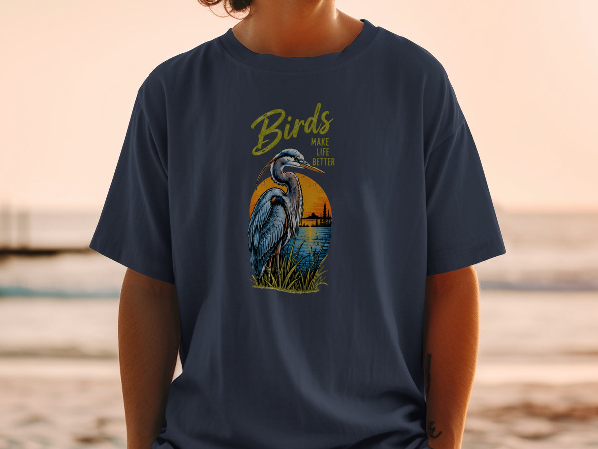 Navy t-shirt with a graphic of a heron, sunset, and text "Birds Make Life Better."