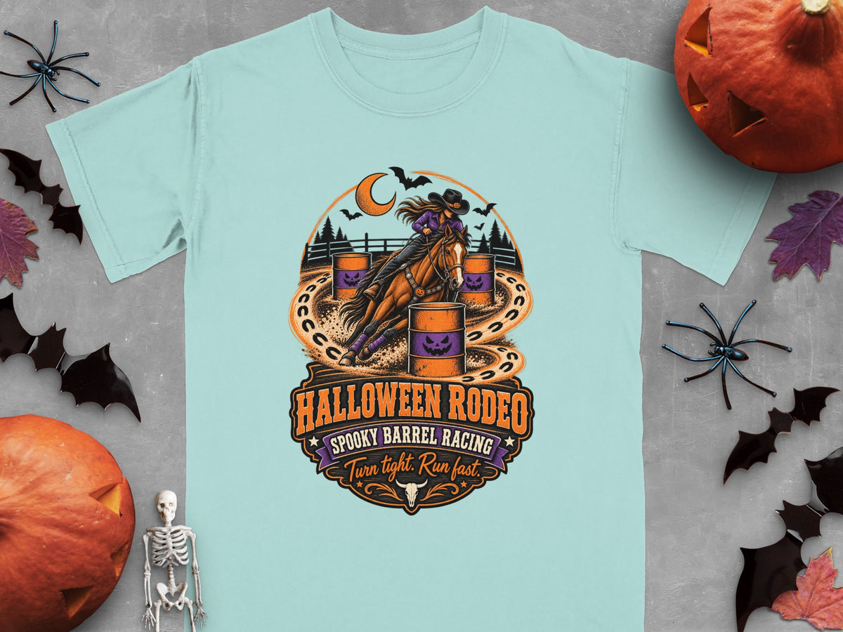 Light blue t-shirt with Halloween Rodeo spooky barrel racing graphic and text.