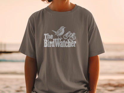 T-shirt with a graphic of a bird and binoculars, and text "The BirdWatcher".