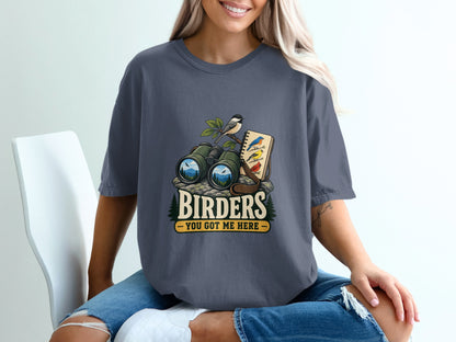 T-shirt graphic with binoculars, birds, and text "BIRDERS YOU GOT ME HERE".