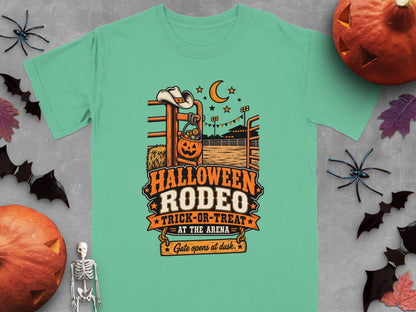 Teal t-shirt with "Halloween Rodeo Trick-or-Treat at the Arena Gate opens at dusk" graphic.