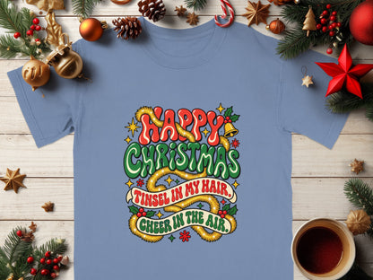 Blue t-shirt with "Happy Christmas, Tinsel in my hair, Cheer in the air" text.