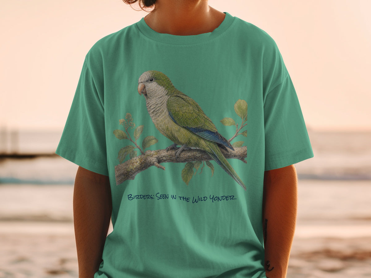 Green t-shirt with a painted monk parakeet perched on a branch with text.